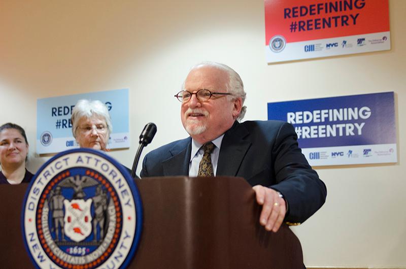 Dr. Calman speaking at podium for DA Vance press conference