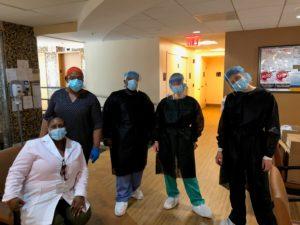 Institute staff who volunteered to assist with COVID-19 testing pose for a portrait at the Family Health Center of Harlem.