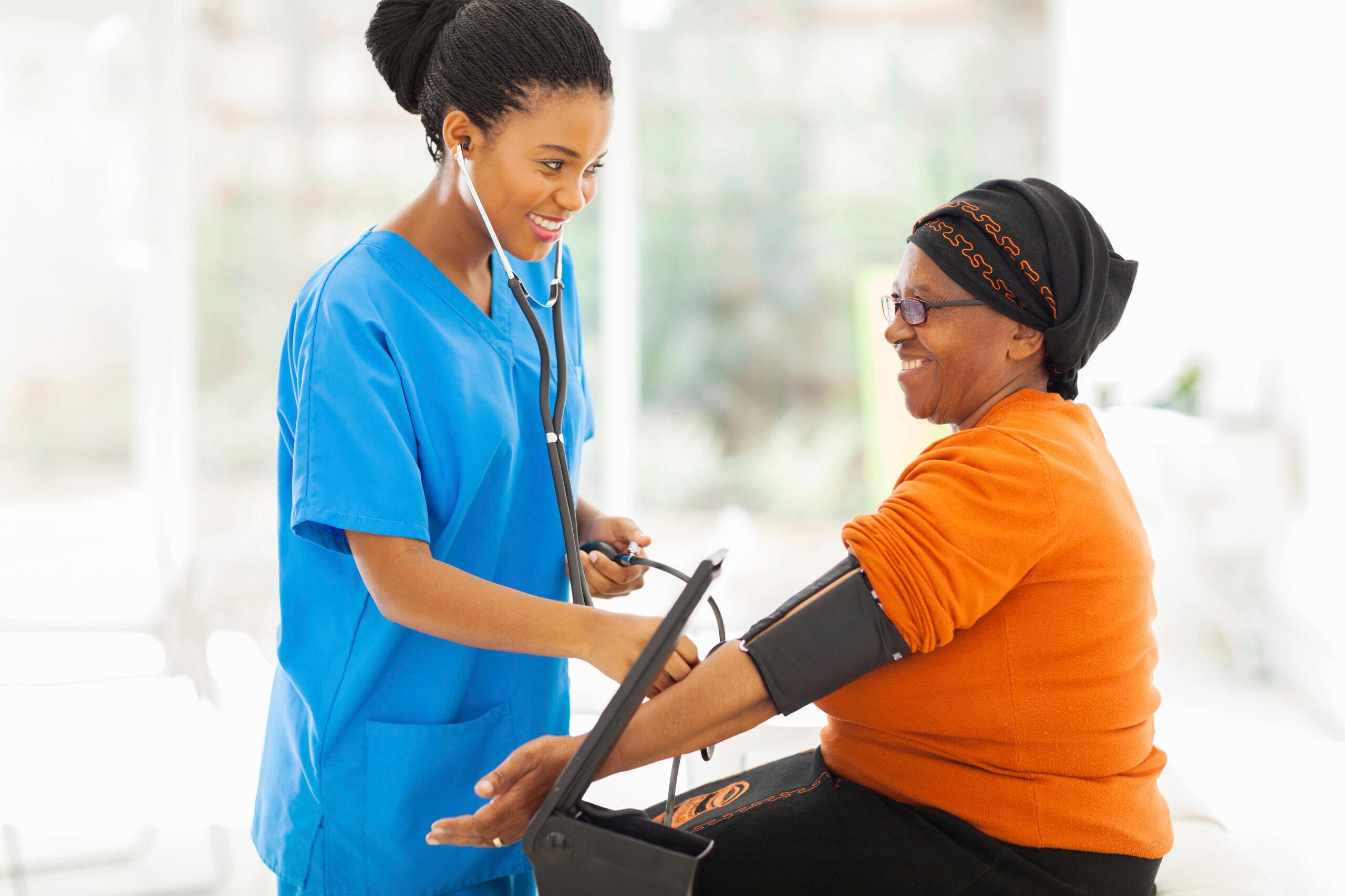 A provider measures the blood pressure of a female patient
